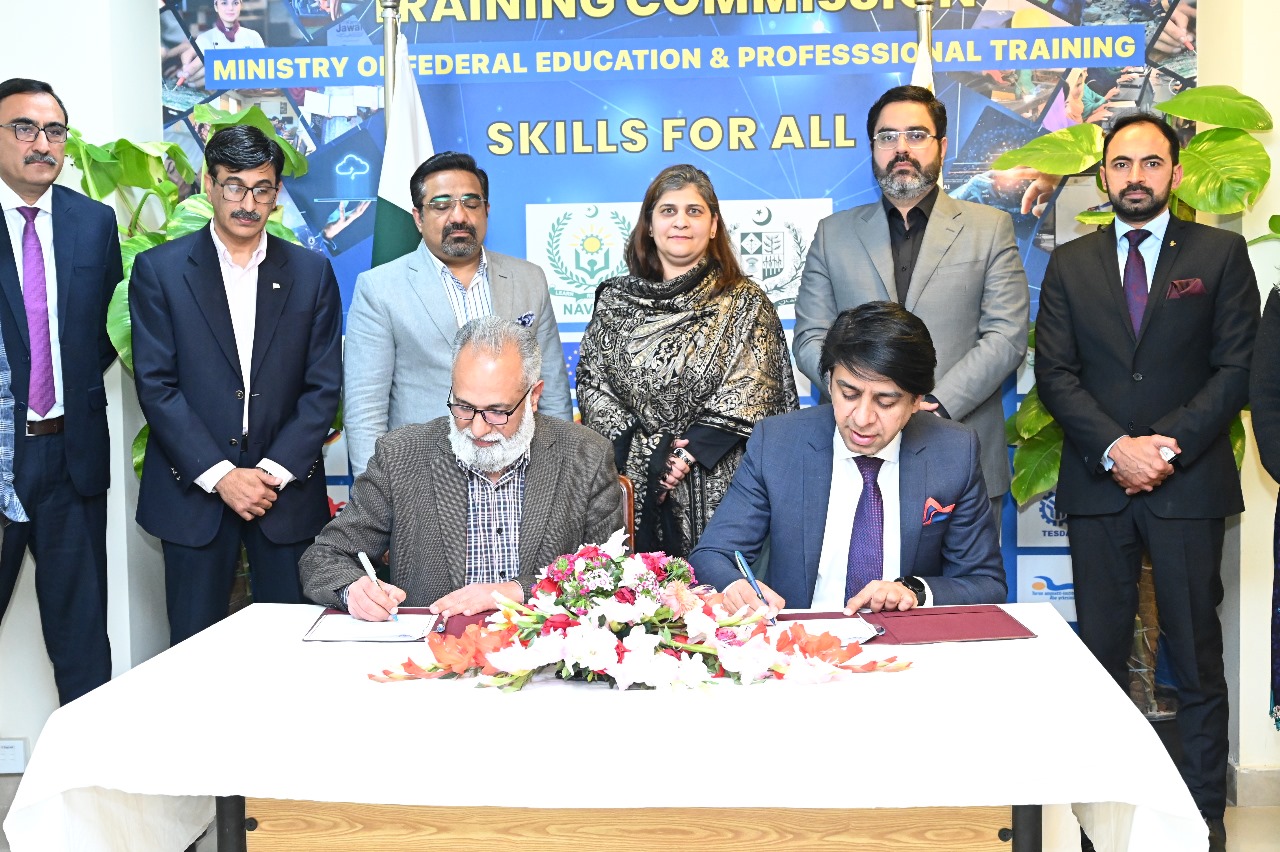 RCCI President Saqib Rafiq signing MOU on behalf of RCCI with NAVTTC.